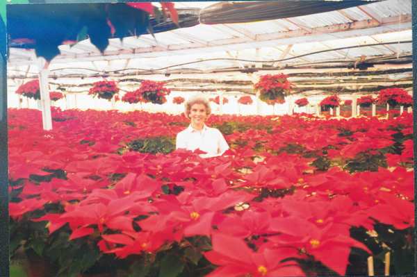 Elisabeth "Jinx" Ecke in a greenhouse
