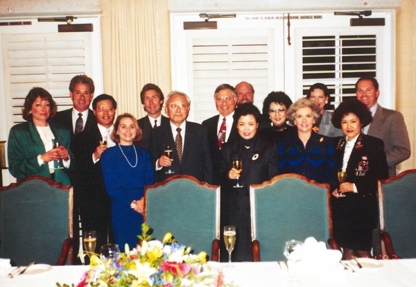 Group photograph of Lizbeth Ecke, Paul Ecke III, Chairman Ha, Paul Ecke, Jr., Chairman Ha's wife, Sue Kint, Elisabeth "Jinx" Ecke at an unidentified event